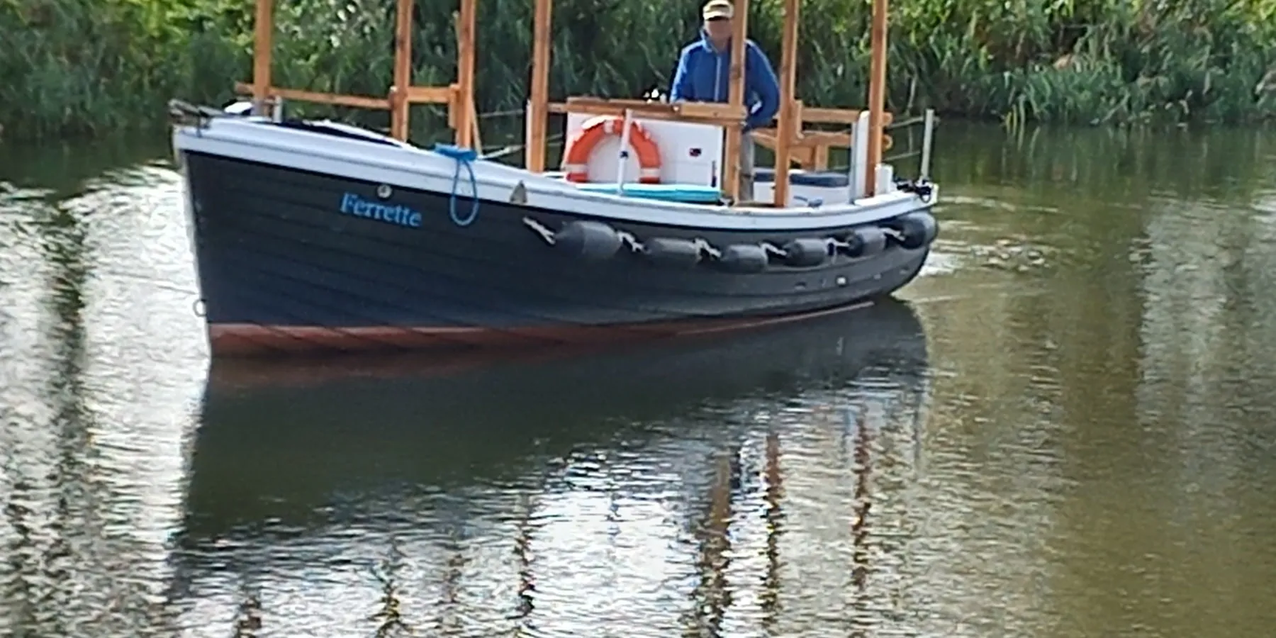 Ferrette under way on the Thames with her Benson Ferry board up