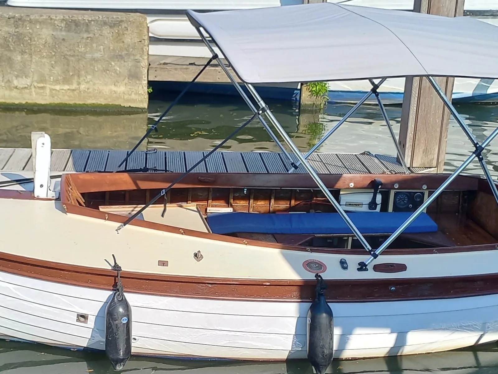 Mistral at the pontoon with her canopy up